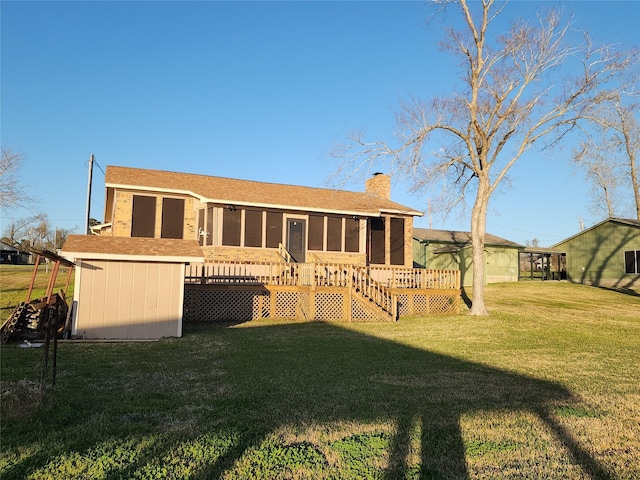 482 W Cattle Dr, Onalaska, TX 77360 - rear view of property with a sunroom, a chimney, a lawn, a wooden deck, and stairway
