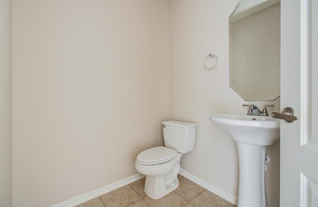 3410 Walden Creek Ln, Pearland, TX 77581 - half bathroom featuring toilet, tile patterned flooring, and baseboards