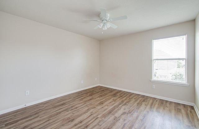 3410 Walden Creek Ln, Pearland, TX 77581 - unfurnished room featuring wood finished floors, a ceiling fan, and baseboards
