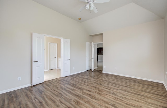 3410 Walden Creek Ln, Pearland, TX 77581 - unfurnished bedroom with wood finished floors, baseboards, high vaulted ceiling, and ceiling fan