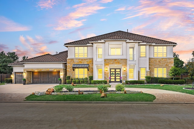 19111 N Frio River Cir, Cypress, TX 77433 - view of front of property with stone siding, driveway, french doors, and an attached garage