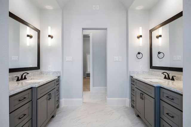 19111 N Frio River Cir, Cypress, TX 77433 - full bath featuring marble look tile flooring, two vanities, and baseboards