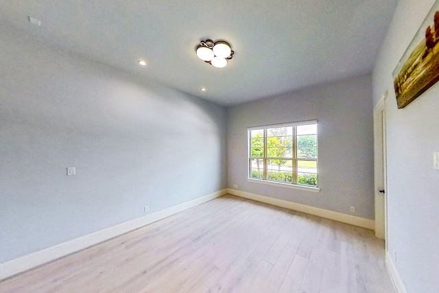 19111 N Frio River Cir, Cypress, TX 77433 - unfurnished room featuring light wood-style flooring, baseboards, and recessed lighting
