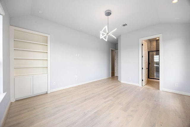 19111 N Frio River Cir, Cypress, TX 77433 - unfurnished dining area with lofted ceiling, a chandelier, light wood finished floors, and baseboards