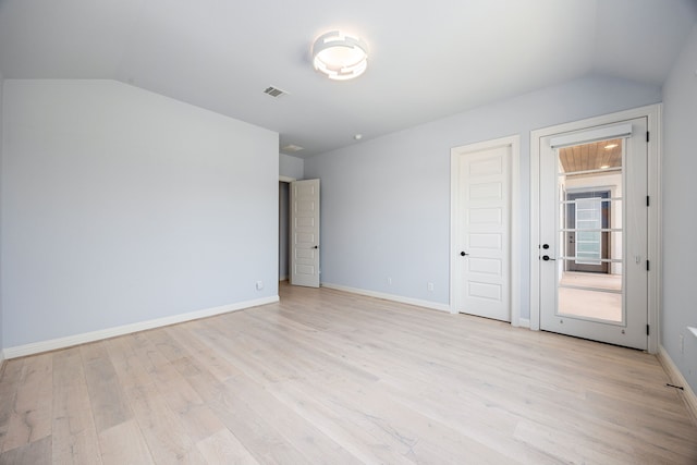 19111 N Frio River Cir, Cypress, TX 77433 - unfurnished bedroom with lofted ceiling, light wood-type flooring, and baseboards