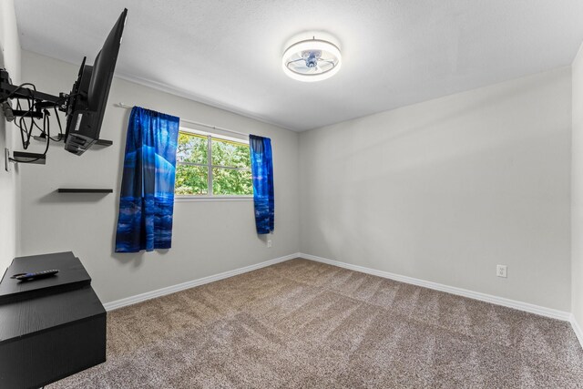 31614 Debbi Ln, Magnolia, TX 77355 - spare room featuring carpet flooring and baseboards