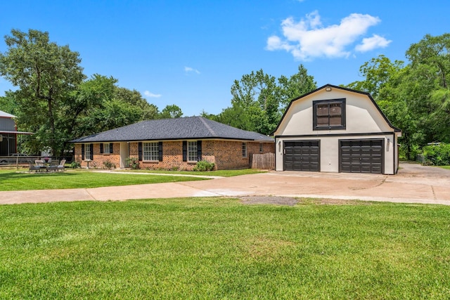 31614 Debbi Ln, Magnolia, TX 77355 - colonial inspired home featuring a detached garage, driveway, and brick siding