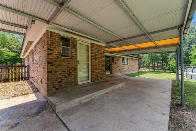 31614 Debbi Ln, Magnolia, TX 77355 - view of patio featuring a carport