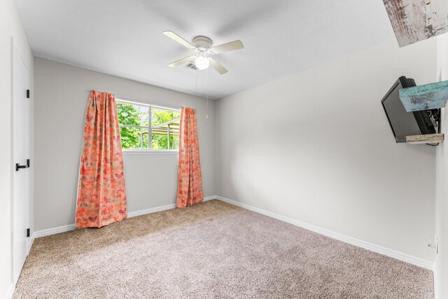 31614 Debbi Ln, Magnolia, TX 77355 - empty room with ceiling fan, carpet flooring, and baseboards