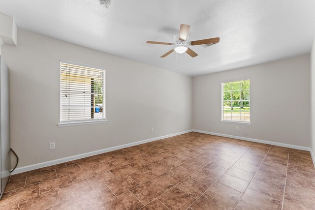 31614 Debbi Ln, Magnolia, TX 77355 - empty room featuring a ceiling fan, baseboards, and a smoke detector