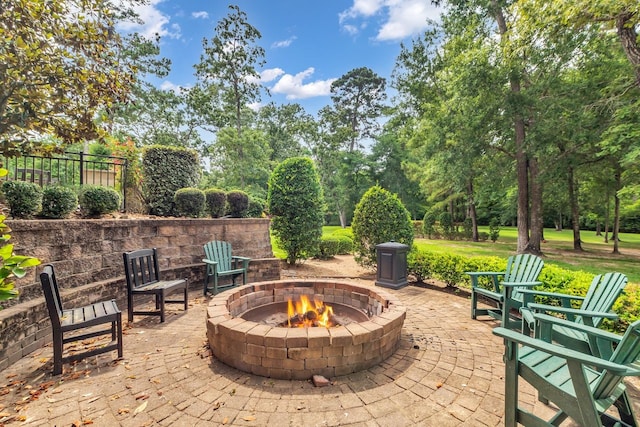 27919 Hansons Ct, Spring, TX 77386 - view of patio with an outdoor fire pit and view of wooded area