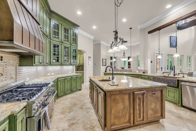 27919 Hansons Ct, Spring, TX 77386 - kitchen with green cabinets, appliances with stainless steel finishes, a sink, ornamental molding, and ventilation hood