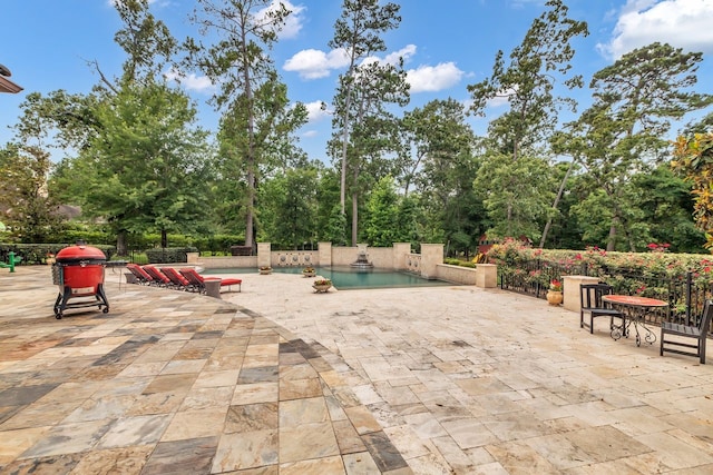 27919 Hansons Ct, Spring, TX 77386 - view of patio featuring an outdoor pool and view of wooded area