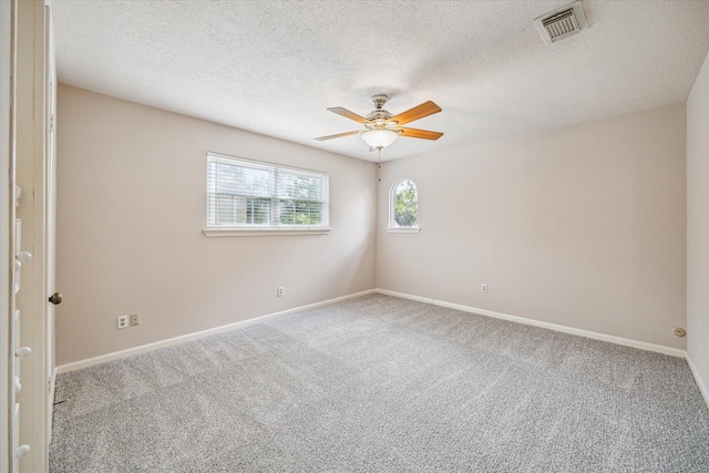 16201 Singapore Ln, Jersey Village, TX 77040 - spare room featuring carpet, ceiling fan, baseboards, and a textured ceiling