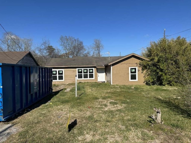 2110 Leight St, Beaumont, TX 77703 - rear view of property with a lawn