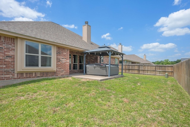 1208 Robinsville Ct, College Station, TX 77845 - view of yard with a hot tub, a patio, and a gazebo
