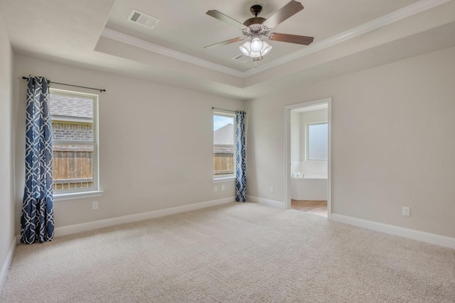 1208 Robinsville Ct, College Station, TX 77845 - empty room with a tray ceiling, crown molding, carpet floors, ceiling fan, and baseboards