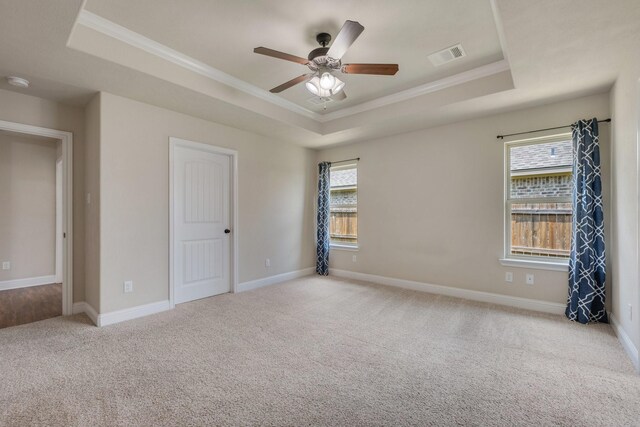 1208 Robinsville Ct, College Station, TX 77845 - unfurnished bedroom featuring a raised ceiling, ornamental molding, carpet floors, baseboards, and a ceiling fan