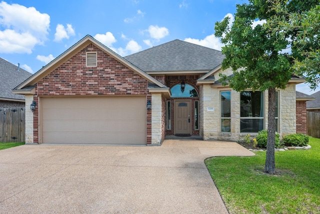 1208 Robinsville Ct, College Station, TX 77845 - french country inspired facade featuring a shingled roof, driveway, and brick siding
