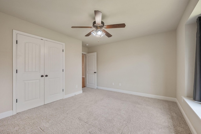 1208 Robinsville Ct, College Station, TX 77845 - unfurnished bedroom with carpet flooring, a closet, baseboards, and ceiling fan