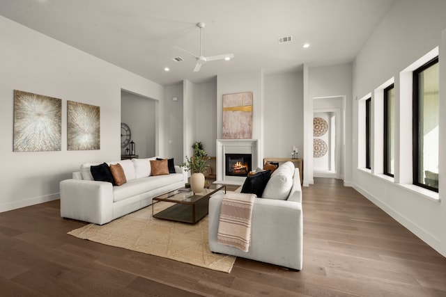 6727 Pine Haven Ct, Katy, TX 77493 - living room with a glass covered fireplace, wood finished floors, recessed lighting, and baseboards