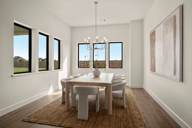 6727 Pine Haven Ct, Katy, TX 77493 - dining space featuring a chandelier, dark wood-style flooring, plenty of natural light, and baseboards