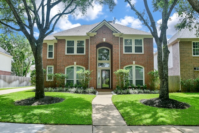 1623 Heddon Falls Dr, Sugar Land, TX 77479 - view of front of house featuring brick siding and a shingled roof