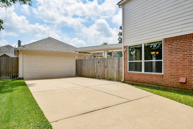 1623 Heddon Falls Dr, Sugar Land, TX 77479 - view of side of home with brick siding, concrete driveway, a garage, and roof with shingles