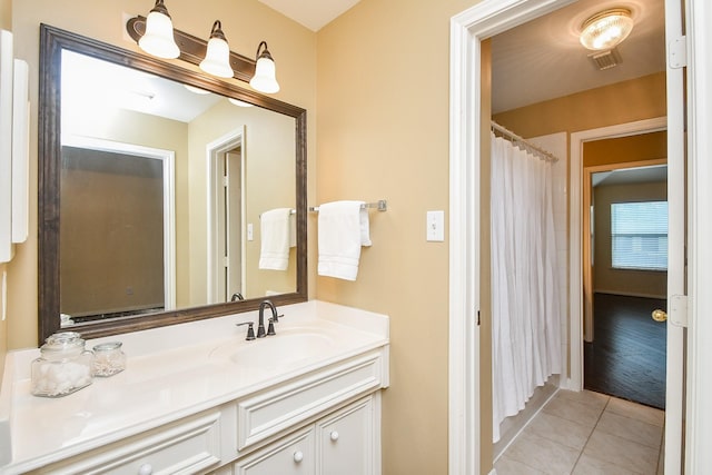 1623 Heddon Falls Dr, Sugar Land, TX 77479 - bathroom featuring vanity, tile patterned flooring, and curtained shower
