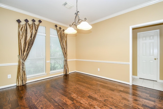 1623 Heddon Falls Dr, Sugar Land, TX 77479 - empty room featuring ornamental molding, wood finished floors, baseboards, and a chandelier