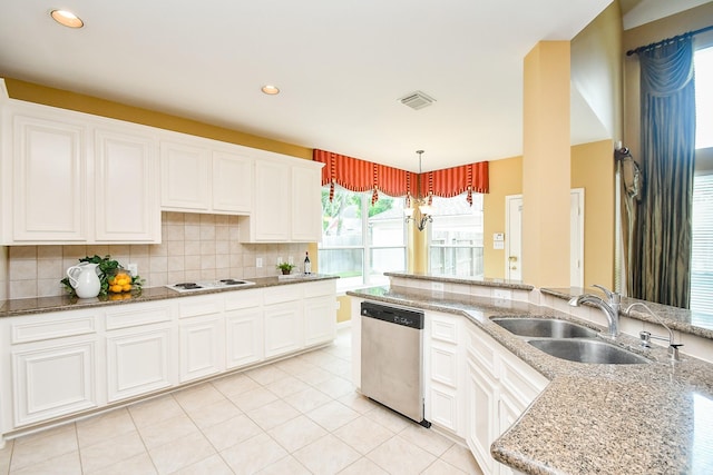 1623 Heddon Falls Dr, Sugar Land, TX 77479 - kitchen with dishwasher, a sink, white stovetop, light tile patterned floors, and tasteful backsplash
