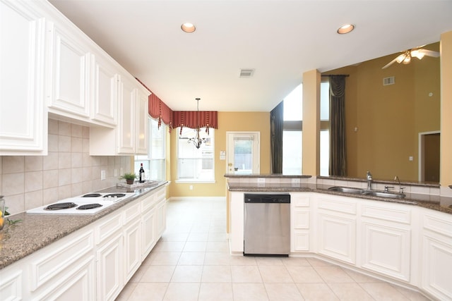 1623 Heddon Falls Dr, Sugar Land, TX 77479 - kitchen with stainless steel dishwasher, a sink, white electric stovetop, decorative backsplash, and baseboards