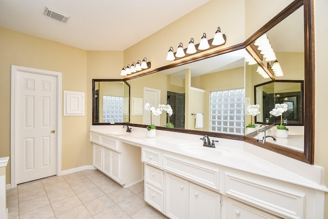 1623 Heddon Falls Dr, Sugar Land, TX 77479 - bathroom featuring double vanity, tile patterned flooring, and tiled shower