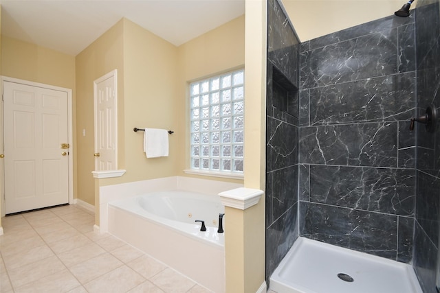 1623 Heddon Falls Dr, Sugar Land, TX 77479 - bathroom featuring tile patterned flooring, a tub with jets, and a tile shower