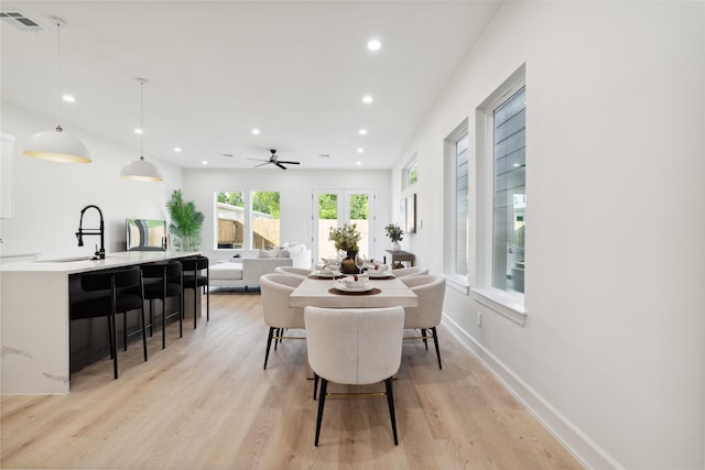 3735 Lydia St, Houston, TX 77021 - dining space with a ceiling fan, recessed lighting, light wood-type flooring, and baseboards