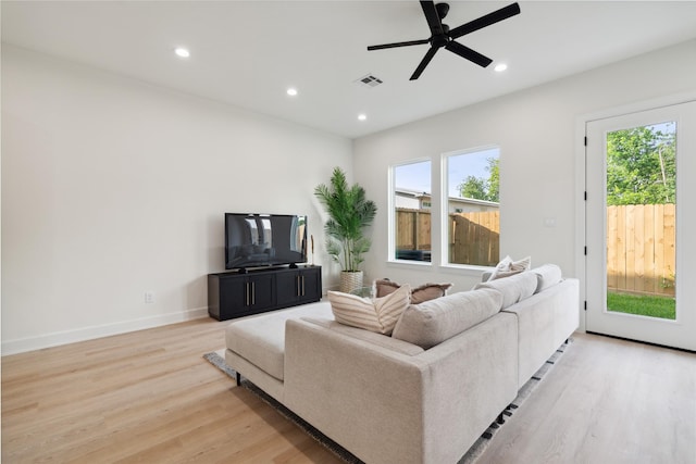 3735 Lydia St, Houston, TX 77021 - living room featuring light wood-type flooring, ceiling fan, recessed lighting, and baseboards