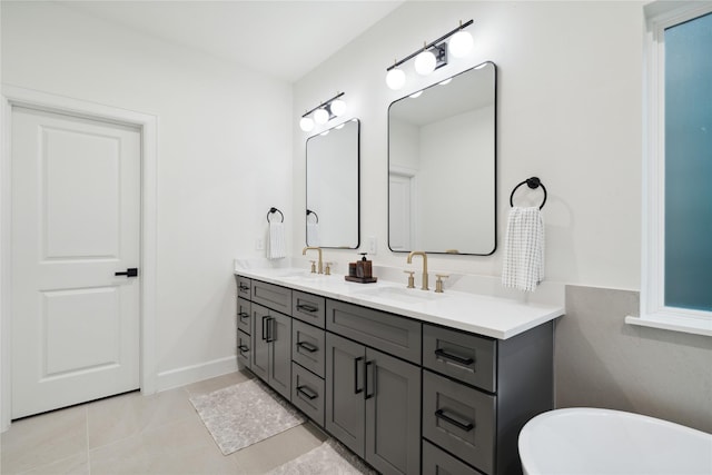 3735 Lydia St, Houston, TX 77021 - full bathroom featuring double vanity, a soaking tub, tile patterned floors, and baseboards