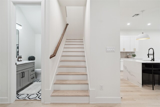3735 Lydia St, Houston, TX 77021 - stairs with recessed lighting and wood finished floors