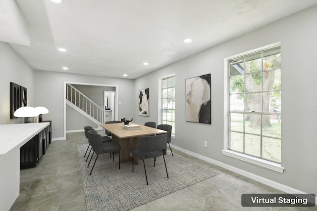 10007 Sagedowne Ln, Houston, TX 77089 - dining space with recessed lighting, stairway, and baseboards