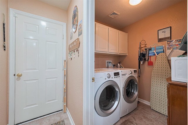 4223 Warwick Dr, Pasadena, TX 77504 - laundry area featuring cabinet space, washing machine and dryer, light tile patterned floors, and baseboards