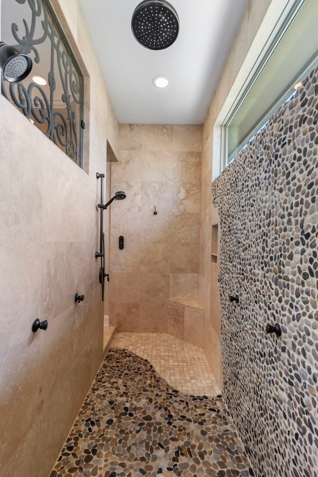 13 Pleasant Shadows Dr, Spring, TX 77389 - bathroom with a tile shower and stone finish flooring