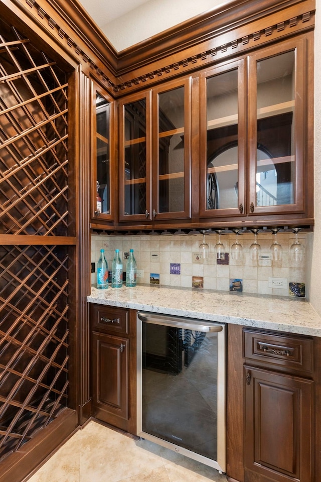 13 Pleasant Shadows Dr, Spring, TX 77389 - indoor dry bar featuring beverage cooler, tasteful backsplash, and light tile patterned floors