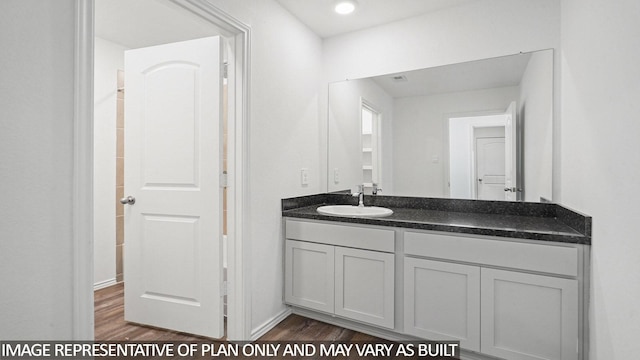 1354 Heather Rosewood Ln, Conroe, TX 77301 - bathroom with vanity, wood finished floors, and baseboards