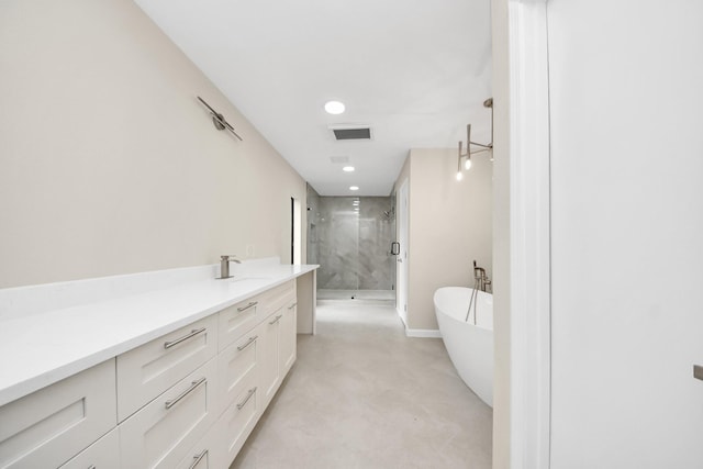 15707 Steamboat Ln, Houston, TX 77079 - bathroom with a shower stall, a freestanding tub, vanity, recessed lighting, and baseboards
