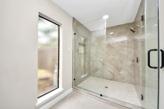 15707 Steamboat Ln, Houston, TX 77079 - full bath featuring a stall shower, marble look tiles, and baseboards