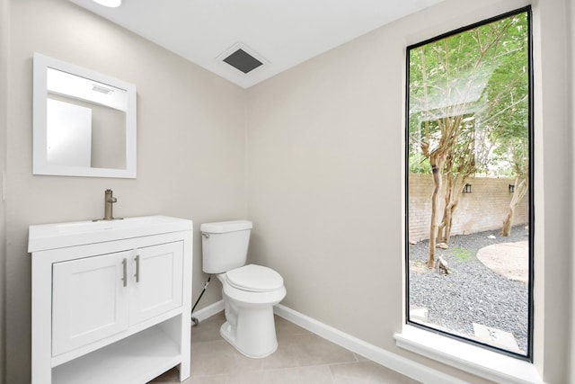 15707 Steamboat Ln, Houston, TX 77079 - bathroom with vanity, toilet, tile patterned floors, and baseboards