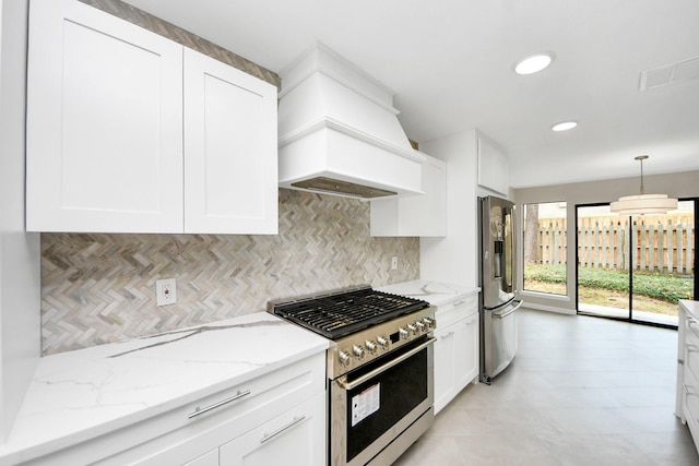 15707 Steamboat Ln, Houston, TX 77079 - kitchen featuring appliances with stainless steel finishes, backsplash, custom exhaust hood, white cabinetry, and recessed lighting