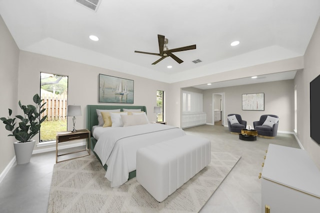 15707 Steamboat Ln, Houston, TX 77079 - bedroom featuring a tray ceiling, recessed lighting, multiple windows, baseboards, and ceiling fan