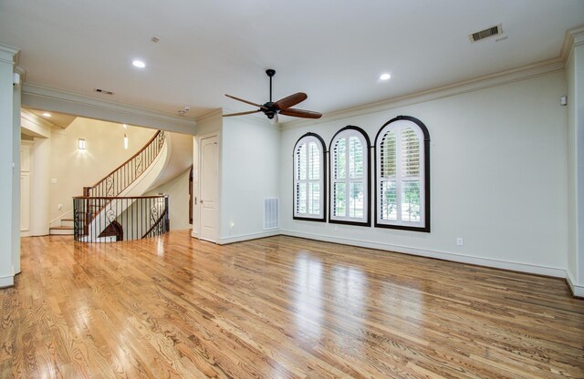 4310 Feagan St Unit A, Houston, TX 77007 - unfurnished living room featuring a ceiling fan, wood finished floors, crown molding, stairs, and recessed lighting