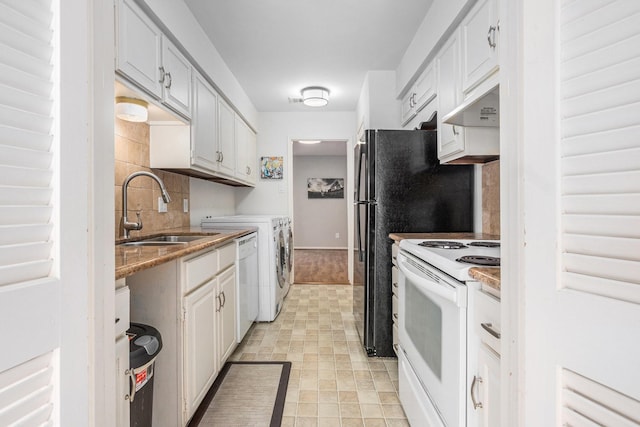 1145 Country Place Dr, Houston, TX 77079 - kitchen featuring white appliances, independent washer and dryer, a sink, backsplash, and white cabinets